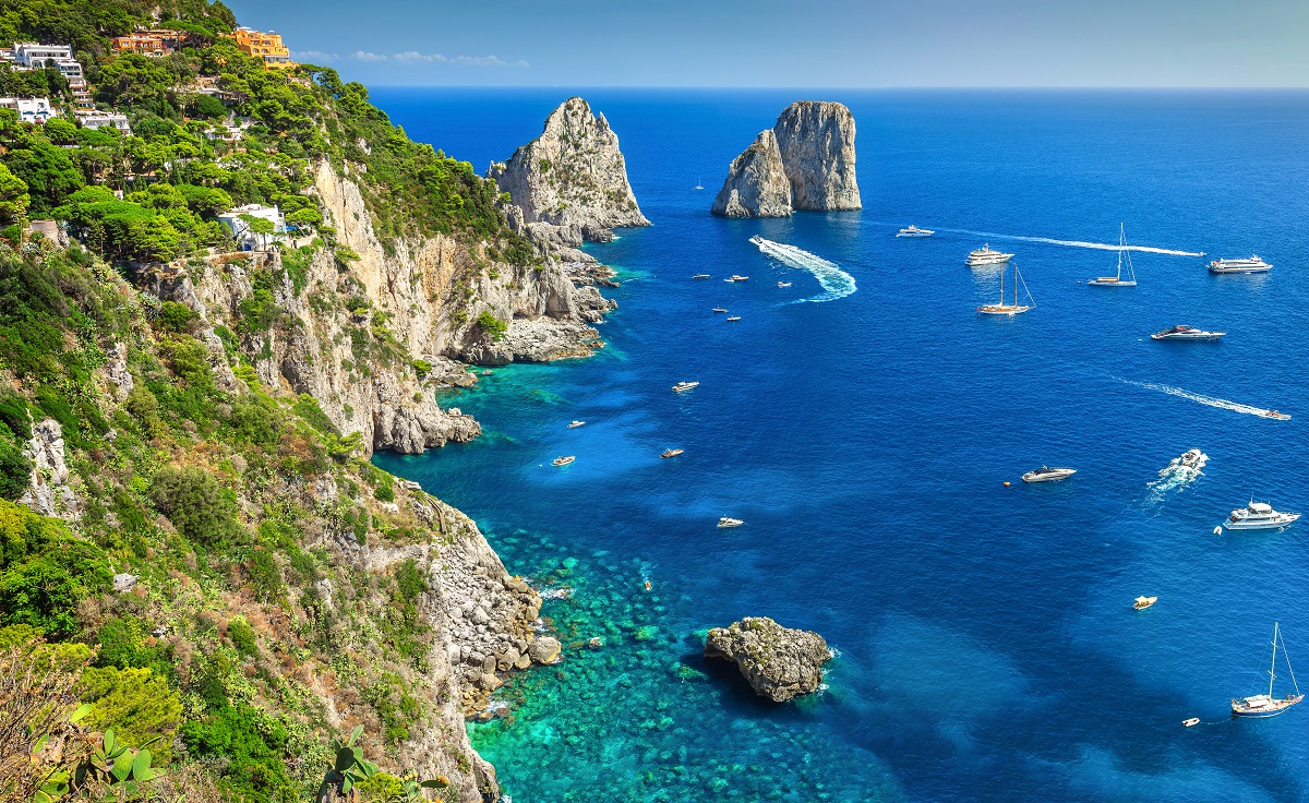Amazing Faraglioni cliffs panorama with the majestic Tyrrhenian sea in background, Capri island, Campania region, Italy, Europe