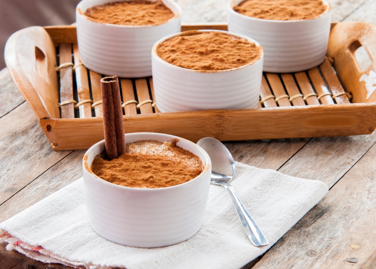 Creamy rice pudding sprinkled with cinnamon